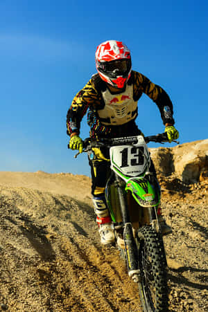 A motocross racer jumps high against a clear sky — Vivo Pad SE Picha ya Ukuta