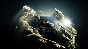 Planet earth with clouds in dark outer space wallpaper