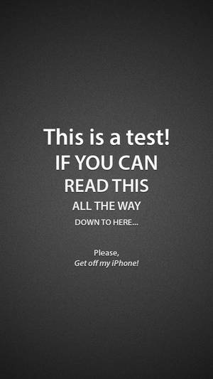Wallpaper ya skrini ya kifaa cha iPhone yenye maandishi 'This Is A Test'.