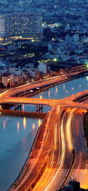 Ho Chi Minh city passing cars wallpaper — iPhone 15 Plus Picha ya Ukuta