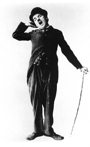 Charlie Chaplin inaweka mwonekano wa kusonona sana wakati unaoweka cane yake wallpaper — Galaxy Tab S9 Ultra Picha ya Ukuta