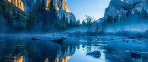 Ultrawide nature landscape of a streambed wallpaper.