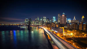 Bright lights cityscape of New York wallpaper.