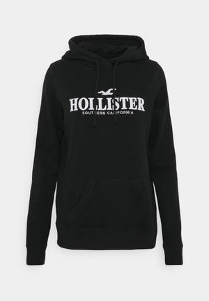 Jacket ya hoodie nyeusi ya minimalist ya Hollister wallpaper — Safi Picha ya Ukuta