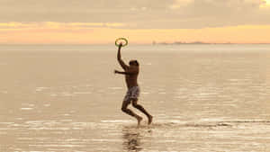 Mandhari ya Frisbee 1440p — Machweo ya ufukweni Picha ya Ukuta