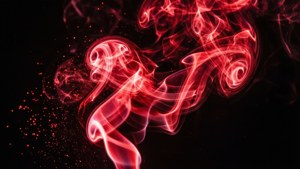 Mviringo wa moshi mwekundu wa neon wenye nguvu kwenye mandharinyuma meusi. — Nyekundu ya neon Picha ya Ukuta