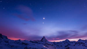 Mwangaza wa siku ya kifaranga katika Alps wallpaper