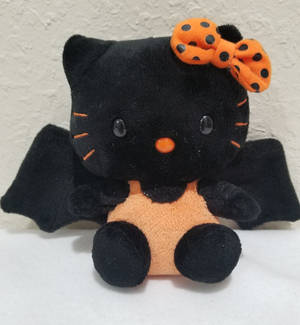 Picha ya mandhari ya Halloween ya Hello Kitty kama popo wa rangi ya chungwa na nyeusi — Hello Kitty Halloween Picha ya Ukuta