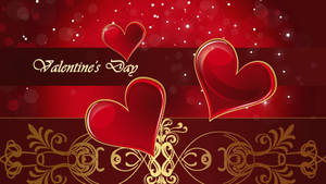 Three red hearts with gold outline on red background with sparkles and gold design with text saying "Valentine's Day". — Chromebook Picha ya Ukuta