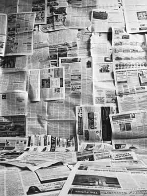 Vintage black and white newspaper stacks — HMD Terra M Picha ya Ukuta